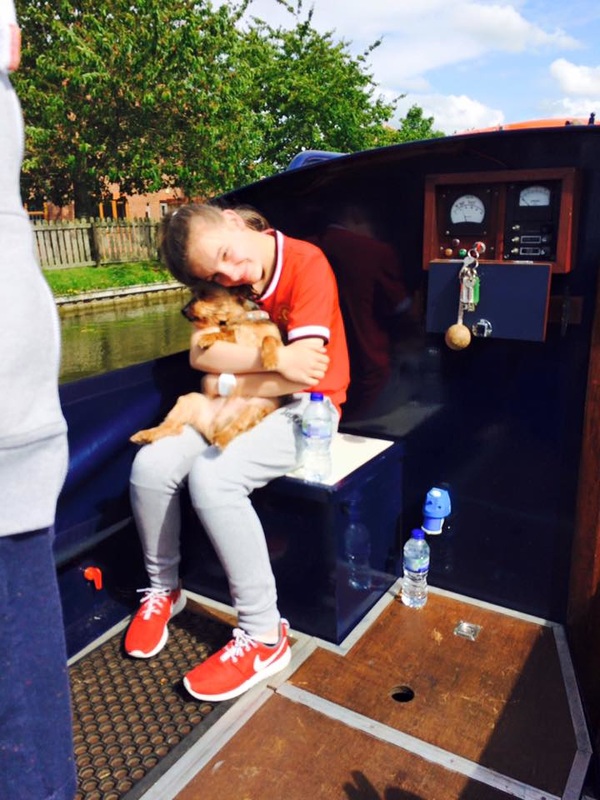 Girl and dog on narrowboat